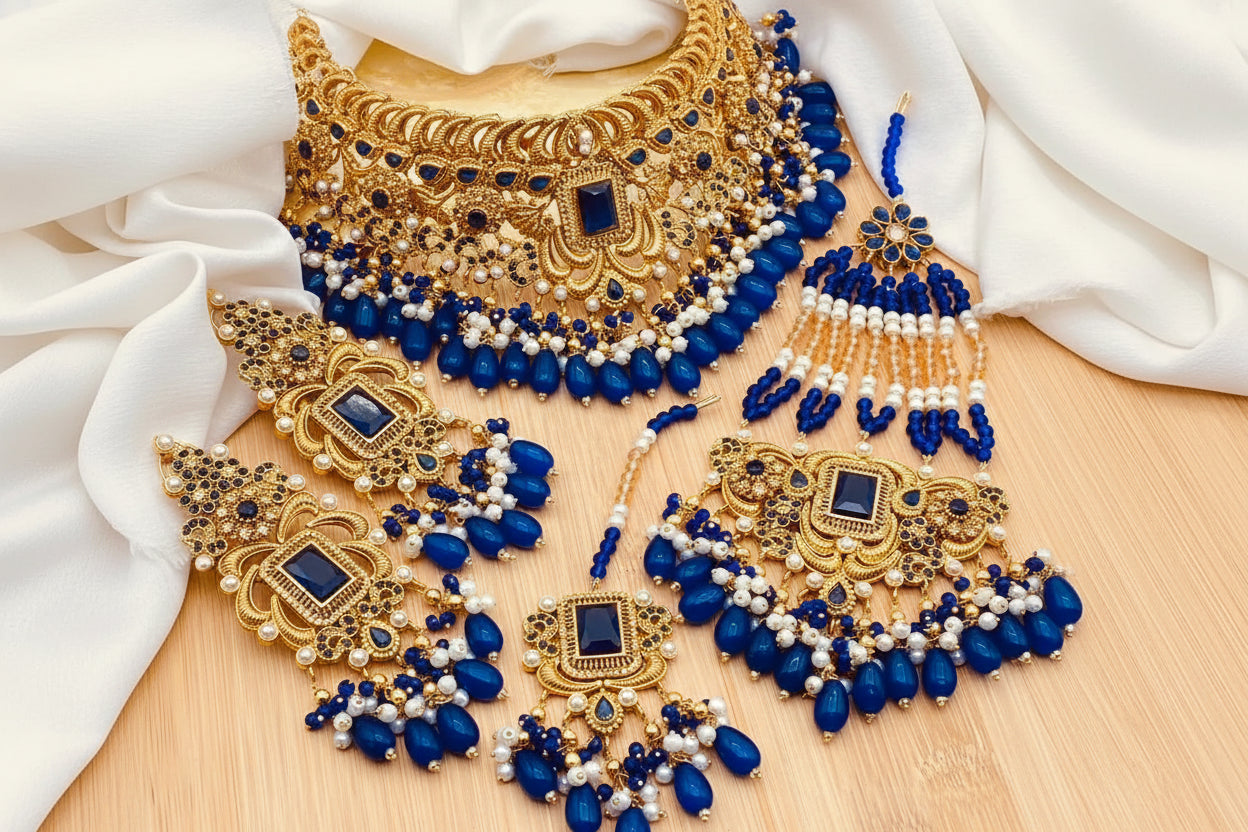 Royal Blue Sapphire & Gold-Plated Bridal Ensemble – Grand Choker, Statement Earrings, Maang Tikka & Sahare Set