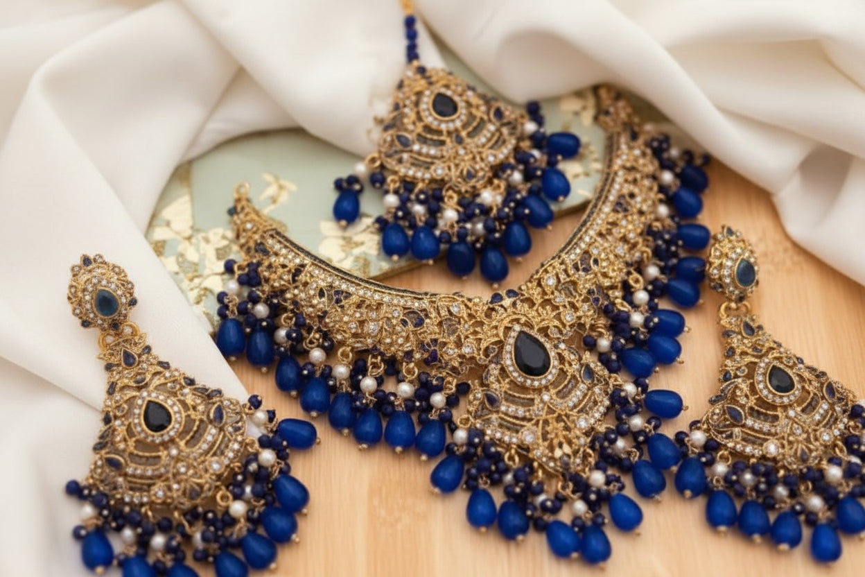 Royal Blue Sapphire & Gold-Plated Bridal Ensemble – Grand Choker, Statement Earrings, Maang Tikka & Sahare Set