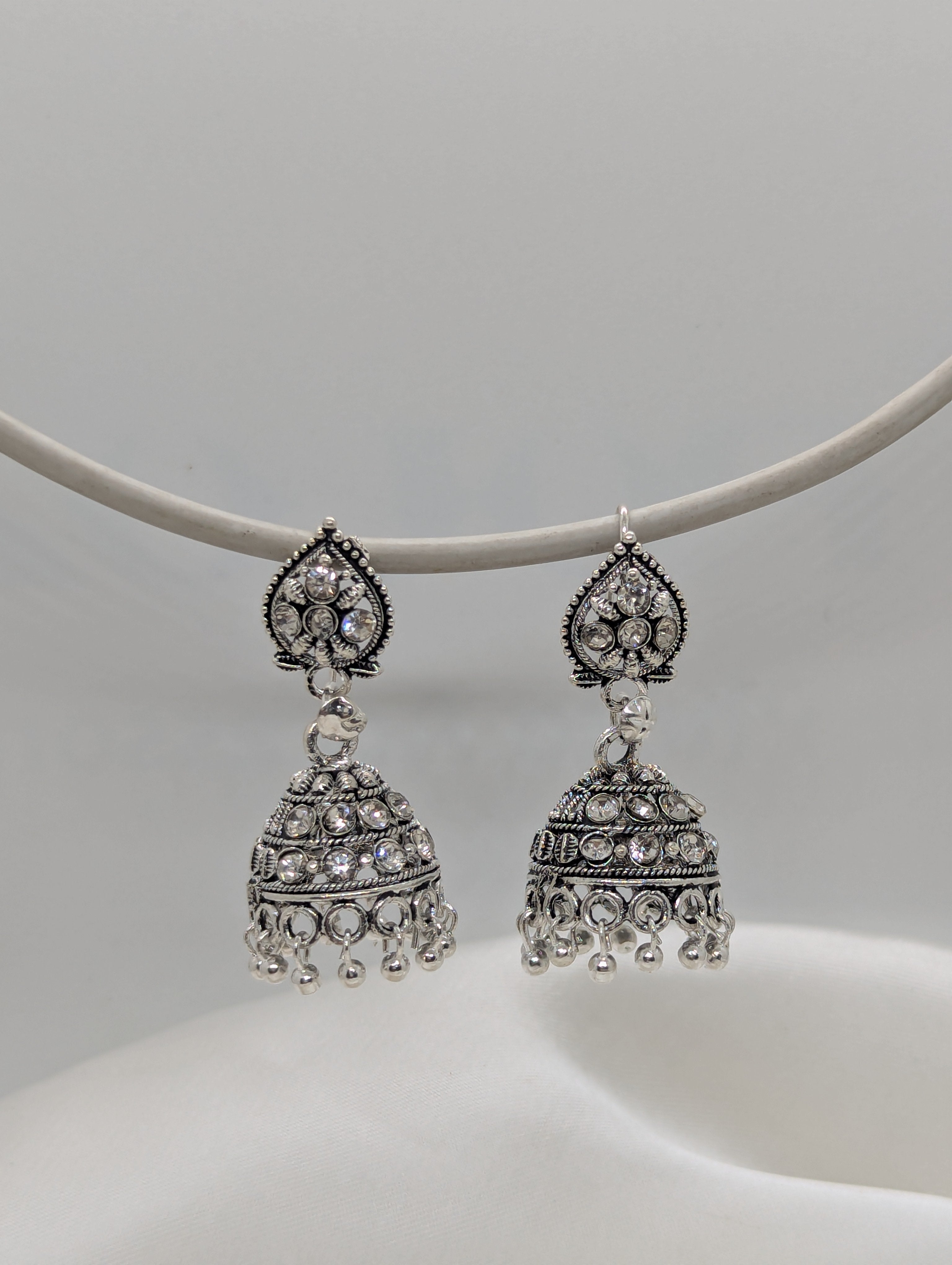 Exquisite Oxidized Silver Jhumka Earrings with Shimmering White Crystals