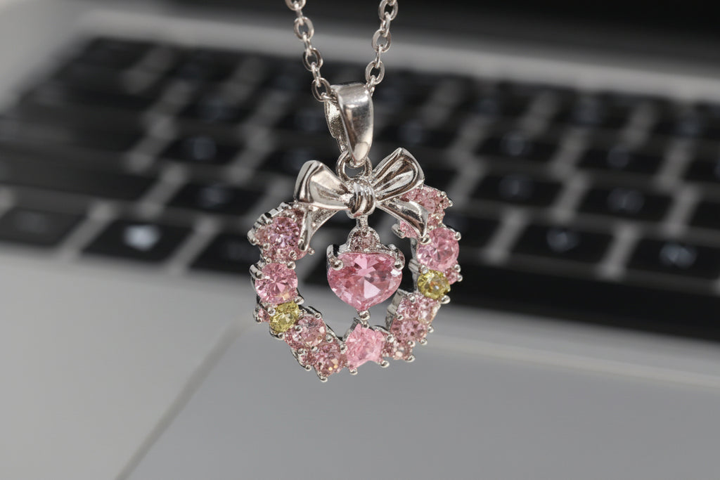 Gemini said Blossoming Grace: Pink Crystal Wreath & Bow Necklace