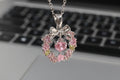 Gemini said Blossoming Grace: Pink Crystal Wreath & Bow Necklace