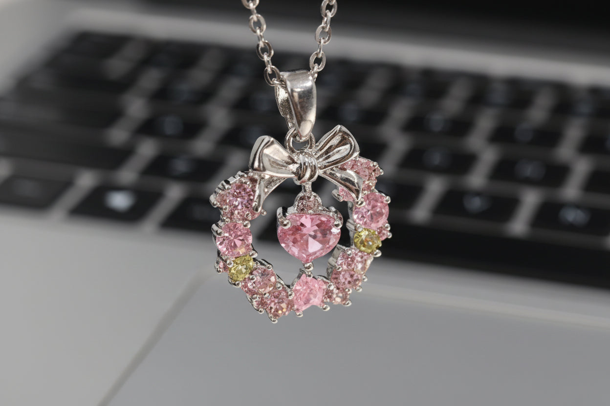 Gemini said Blossoming Grace: Pink Crystal Wreath & Bow Necklace